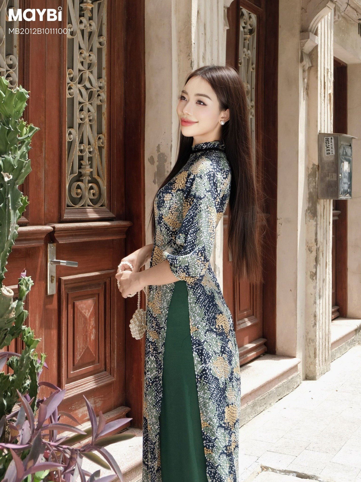 Áo dài ôm lụa in họa tiết xanh phối nơ cổ