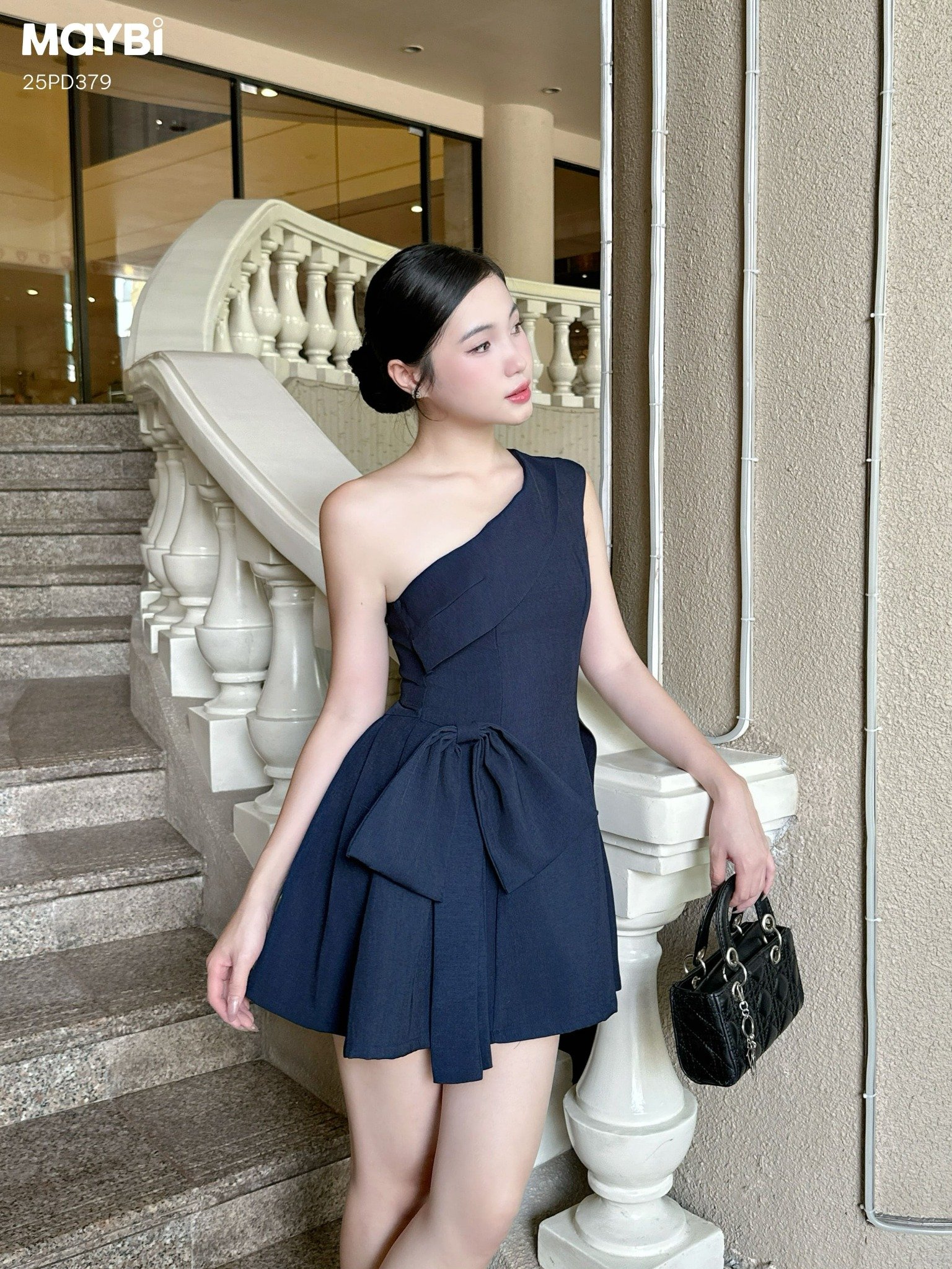 Đầm xòe lệch vai đính nơ dáng mini